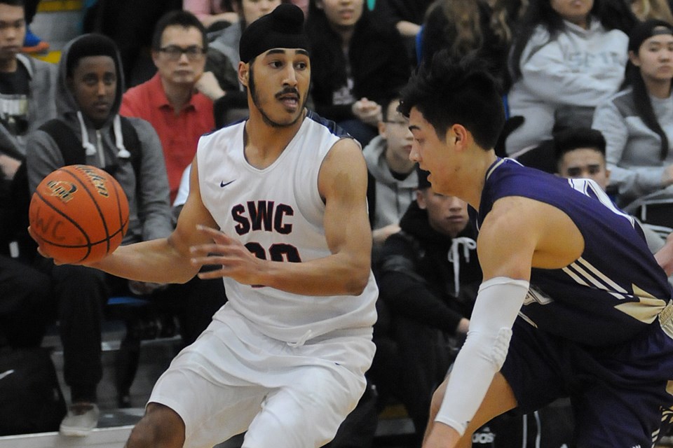 Churchill Bulldog Gary Minhas (No. 30) looks to make a play in a 103-90 semi-final win over 鶹ýӳCollege in the senior boys AAAA Lower Mainland tournament at the Richmond Olympic Oval on Feb. 25, 2015. Photo Dan Toulgoet