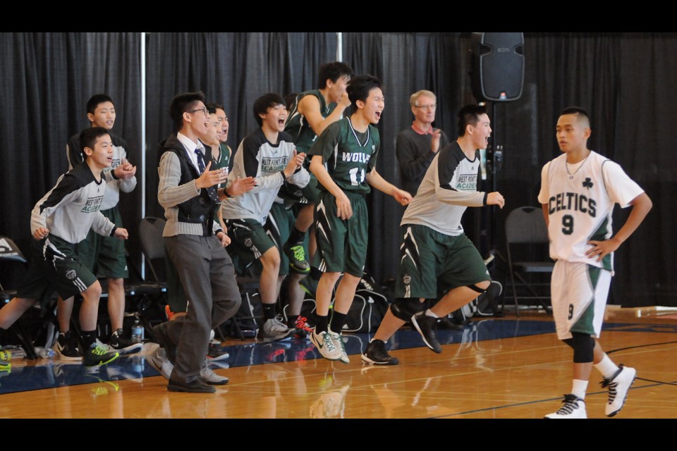 West Point Grey Academy celebrates a 65-63 win over St. Patrick's in the senior boys single-A Lower Mainland semi-final at the Richmond Oval on Feb. 24, 2015. Photo Dan Toulgoet