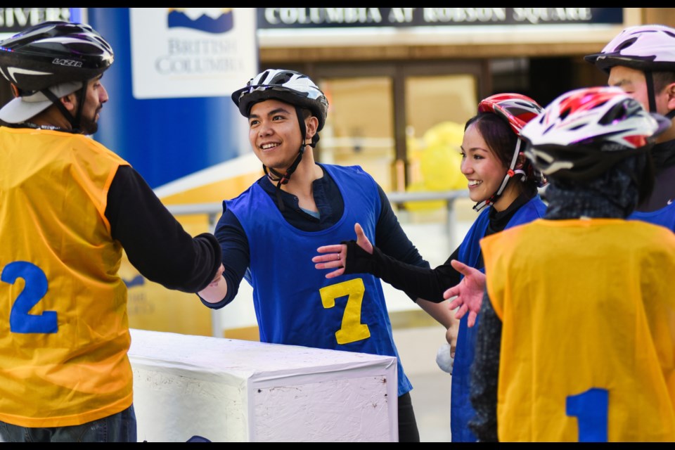 Each game of yukigassen starts with a handshake between the two teams at the centre line. Yukigassen, the snowball battle, was held at Robson Square this past Saturday. The tournament was held in the morning and the public was invited to play drop-in games for five dollars in the afternoon, with proceeds going to the Canadian Cancer Society. Photograph by: Rebecca Blissett