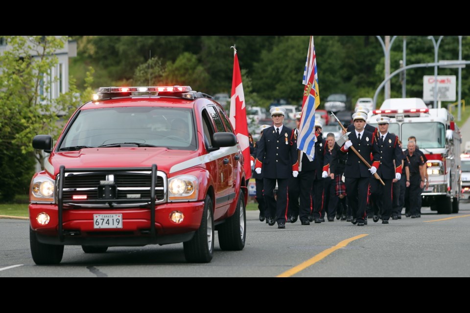 Firemen parade up to the official inauguration of the new base firehall and emergency reponse centre at Canadian Forces Base Esquimalt