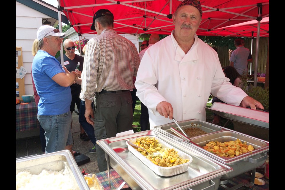 New Westminster resident Eoin White served traditional Nepalese food at his fundraising party for quake victims in Nepal. Party attendees brought bags of clothes and shoes, cheques and cash to help the cause.