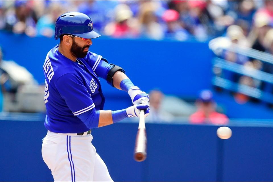 Toronto Blue Jays' Jose Bautista hits a homerun during seventh inning MLB action against the Houston Astros on Sunday.