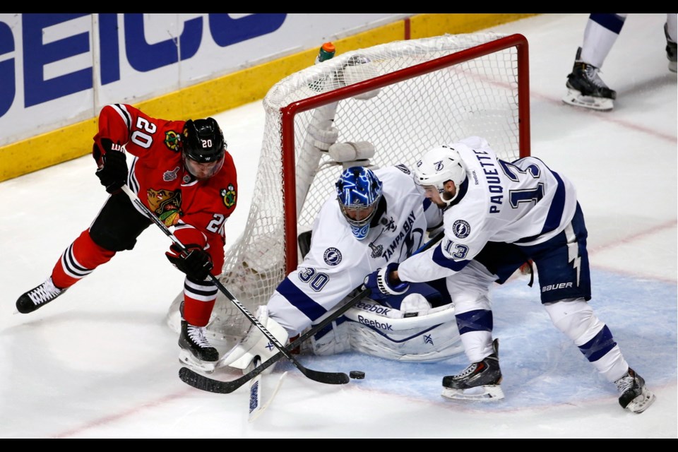 Chicago Blackhawks fans cheer after a goal by Blackhawks' Brandon Saad during the third period in Game 4 of the NHL hockey Stanley Cup Final against the Tampa Bay Lightning Wednesday in Chicago.