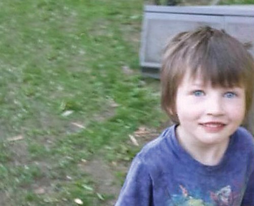 Dane LaFortune, 6, before school worker cut his hair without permission.