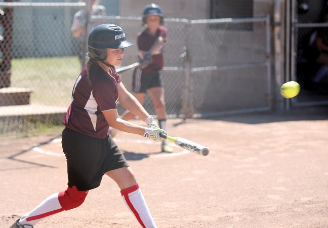 Amelia Musselman of the Quesnel Elks, makes contact with the ball during Sunday afternoon's bronze medal game of the Prince George U12C Girls regional softball tournament.