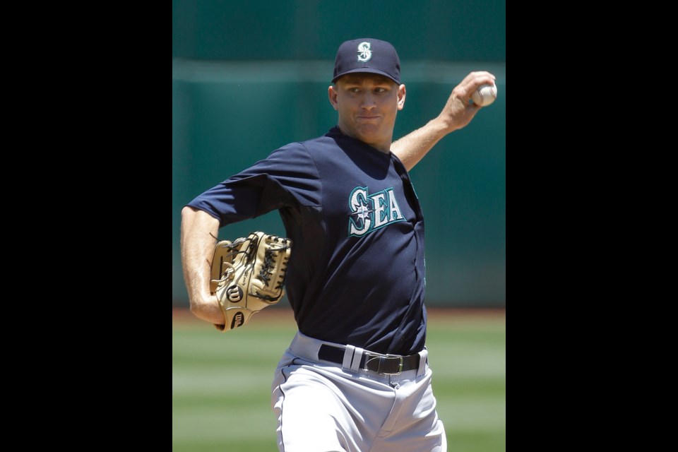 Seattle Mariners pitcher Mike Montgomery throws during the first inning of Sunday's game against the Oakland Athletics in Oakland, Calif.