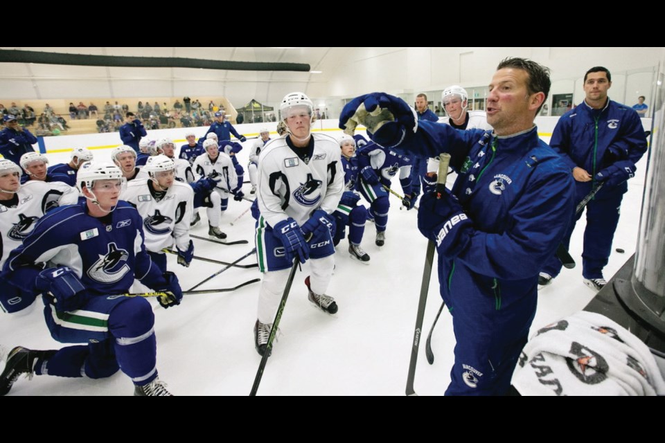 Players hoping to make the team take direction from coaches at the Vancouver Canucks' 2015 development camp at Shawnigan Lake School on Monday. The camp continues through Wednesday.