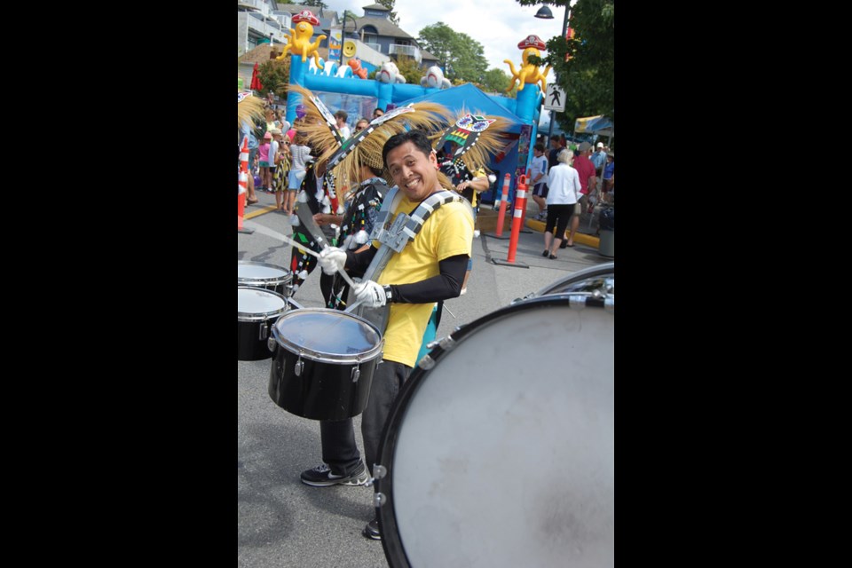 This year’s Sea Cav parade featured hot cars and high-stepping horses, pipers and drummers, veterans and Golden Girls, ethnic dancers and ukulele playing hula girls (and guys). Pictured is Arthur Isidro, a member of Aklanon Santo Nino Association of BC, who was marching with the Sunshine Coast Filipino-Canadian Association. See more photos in our online galleries.