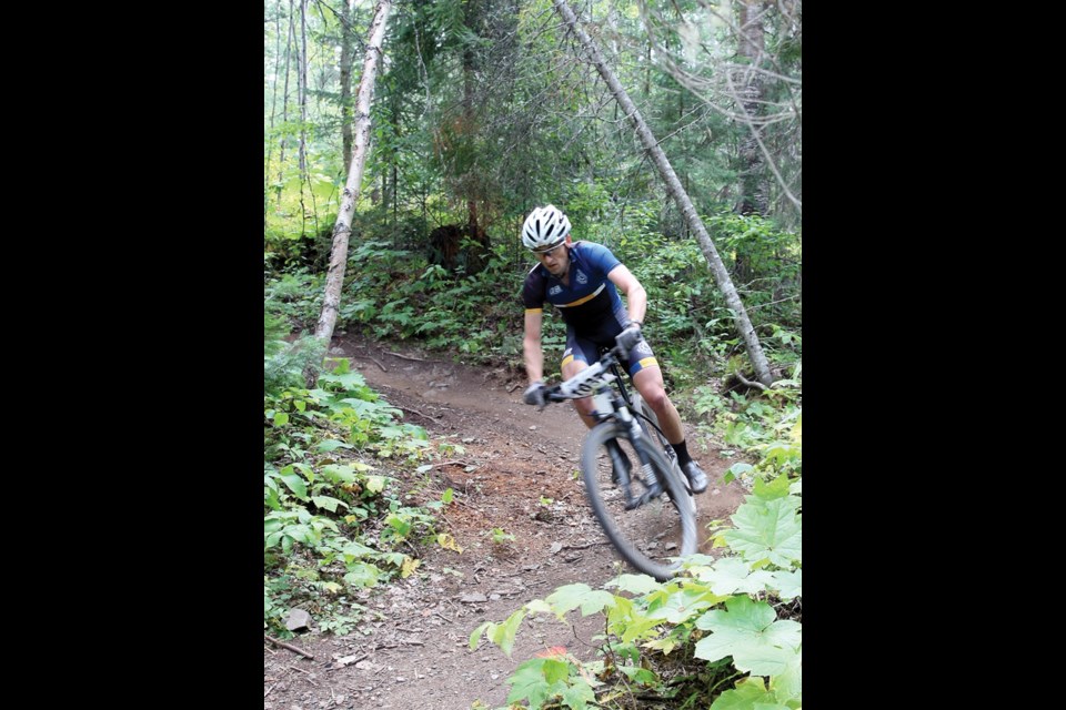 Tom Skinner makes his way through the singletrack and was the eventual winner of the expert class in the inaugural Hot Day at Otway at the Otway Nordic Center on Sunday. The event featured a cross country bike race, live music, and a water balloon cool down station.