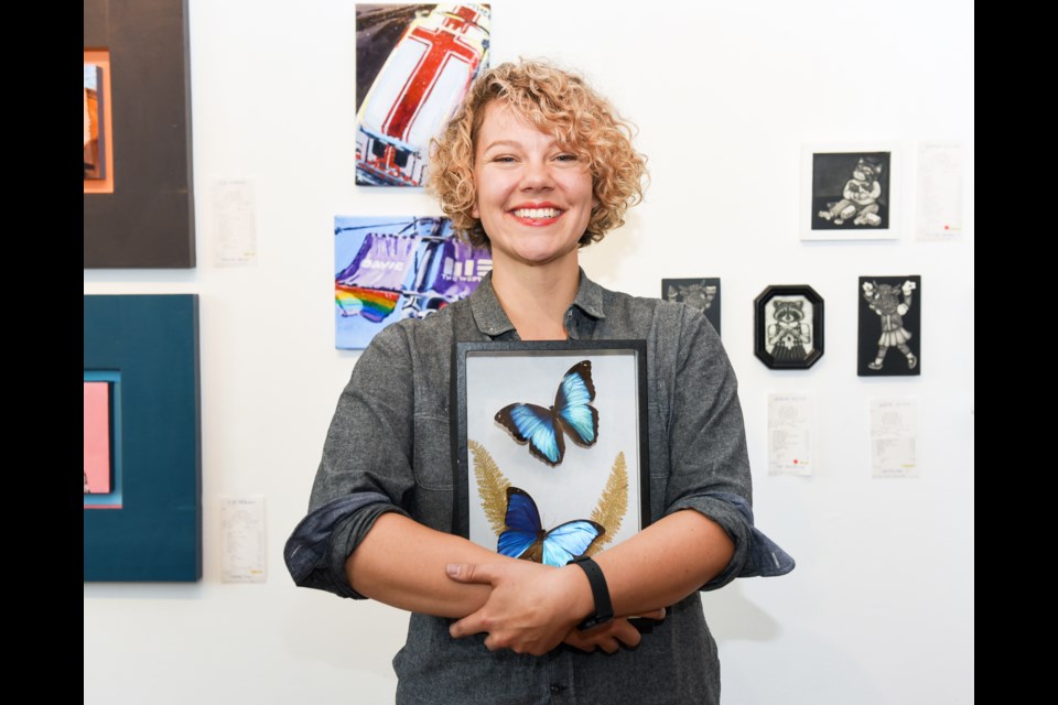 - Erin Gibbs sold butterfly and bug specimens as part of her collection at the first-ever Main Street Flea at Hot Art Wet City this past weekend. Photograph by: Rebecca Blissett