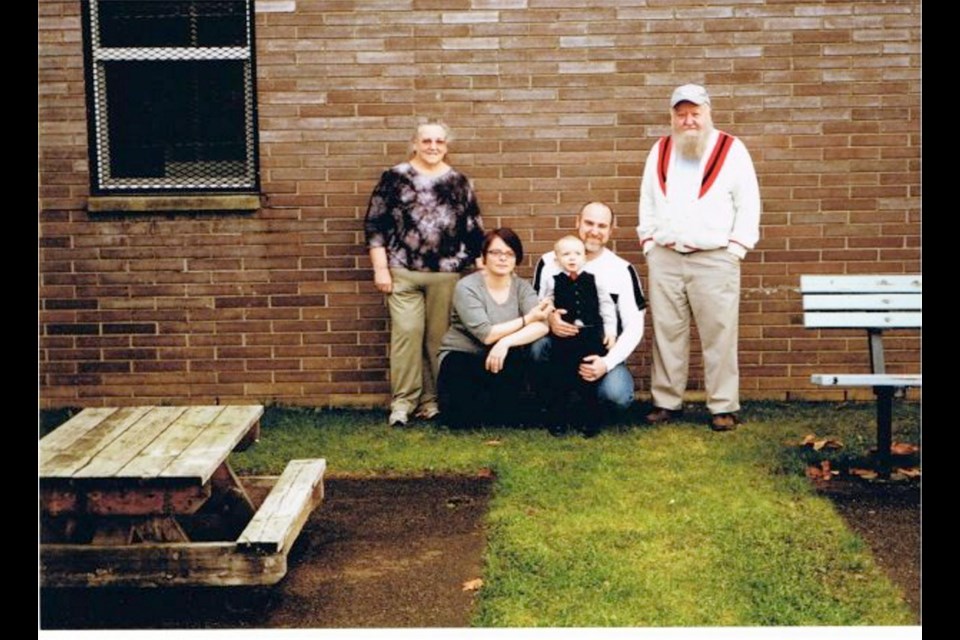 A 2014 photo from the Facebook page Free Derik Lord shows Derik Lord with his parents, his partner who is identified on the Facebook site as Jasminda Hanbury, and his young son.