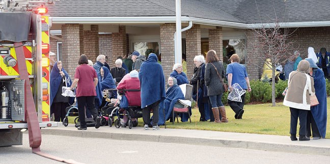 Residents of Prince George Chateau are evacuated from the building after there was a small fire.