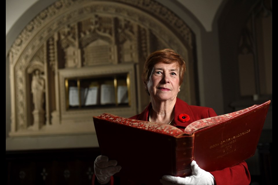 Linda Denham has attended Canadian Memorial United for 40 years and helps organize the annual Remembrance Day commemorations. She points out that members of the public don’t need to wait for the annual commemoration to view the Books of Remembrance, one of two sets in existence in Canada. photo Dan Toulgoet