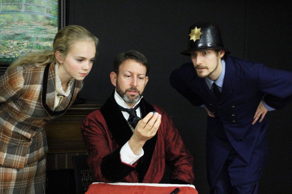 Karissa Ketter as Watson, Gavin LeClaire as Sherlock Holmes and Adam Tatelman as Commissioner Peterson in Sherlock Holmes’ Christmas Goose.