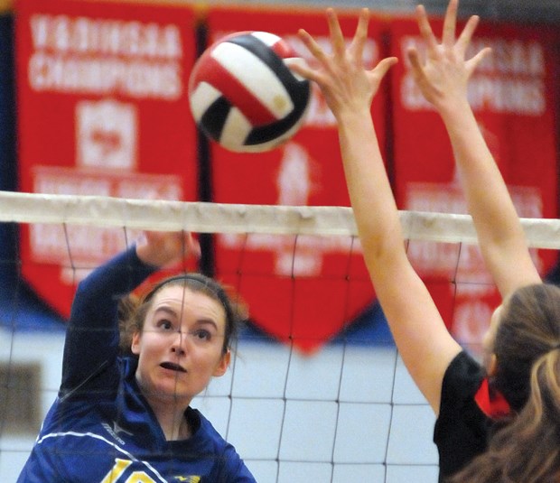 Danielle Corrigan rips a spike during Handsworth’s win over St. Thomas Aquinas in the North Shore premier league final on Nov. 12. photo Paul McGrath, North Shore News