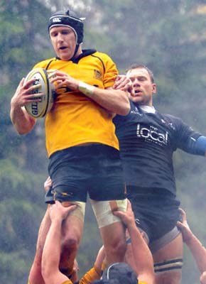 Capilano Rugby Club men's team (yellow) in action against James Bay in CDI Premier League play at Klahanie Park.