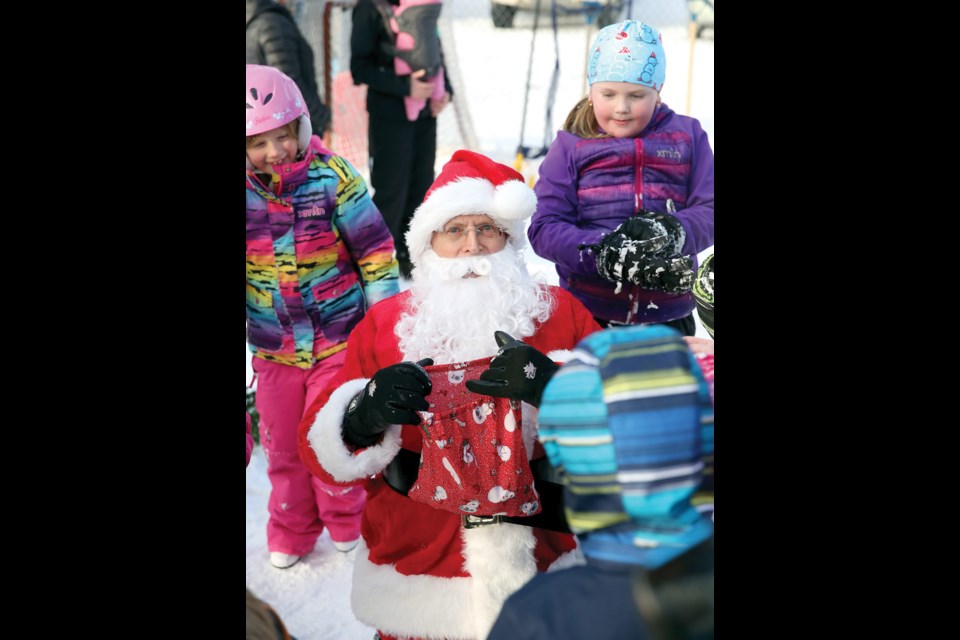 Santa visits with kids on Sunday at the Ridgeview Rink on Ridgeview Drive in the Hart at the Hart Community Association's 7th Annual Skate with Santa.