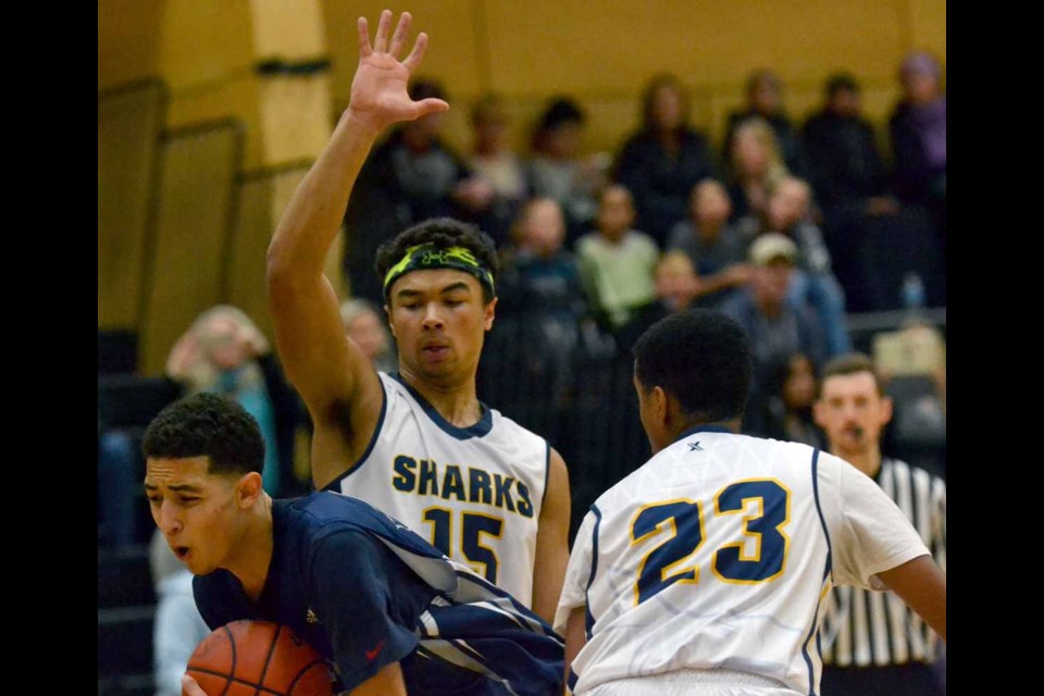 Malik Holmes, left, was one of the on-floor leaders for the Byrne Creek Bulldogs at last week's tournament in Richmond. He was joined on the all-star squad by teammates Stanley Ho and Grade 9 Bithow Wan.