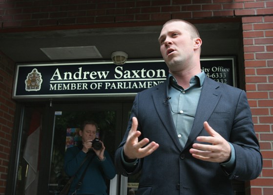Jamie Biggar, Executive director of leadnow.ca speaks at a protest outside of Andrew Saxton's office on Saturday. Part of a nationwide protest of Omnibus Bill C38.