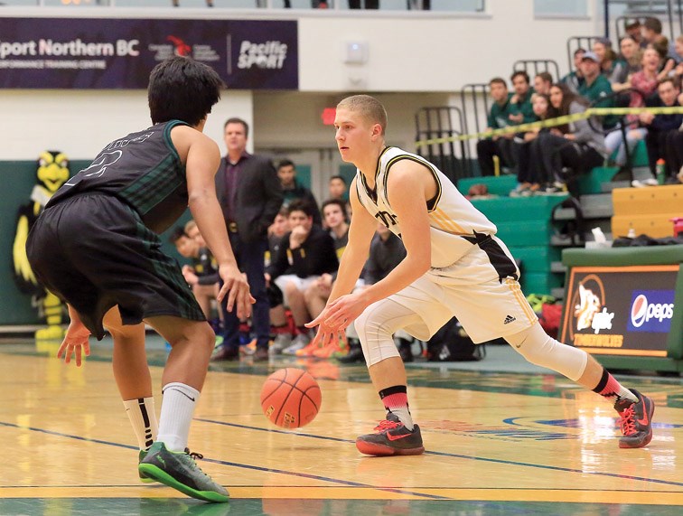 Duchess Park Condors Colburn Pearce looks for a way around Prince George Polars Keaton Fisher on Tuesday at Northern Sport Centre. The Condors and the Polars met in the men's championship game of the Prince George Sr. High School Basketball League. Citizen Photo by James Doyle February 9, 2016