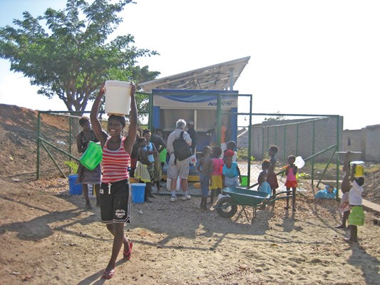 Residents in Bom Jesus, Angola, draw water from a newly installed Aquatap Community Drinking Water Station, designed by North Vancouver company Quest Water Solutions. Based on the success of the inaugural unit, Quest hopes to supply thousands more to the African country, filling a tremendous need.