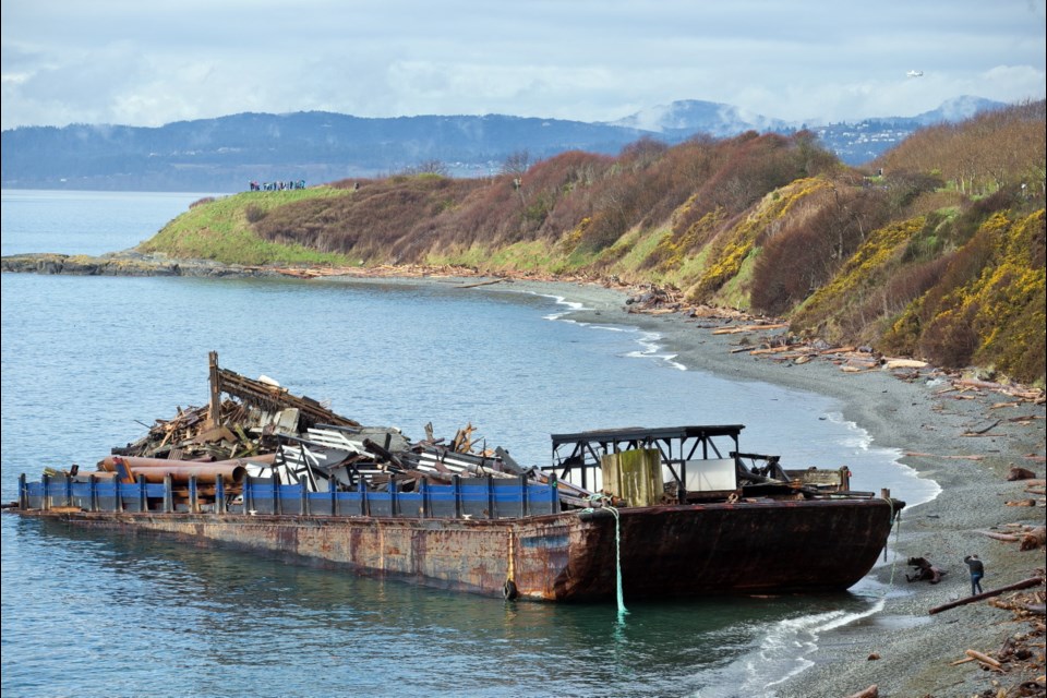 Barge that hit shore in stormy sea remains aground - Victoria Times ...