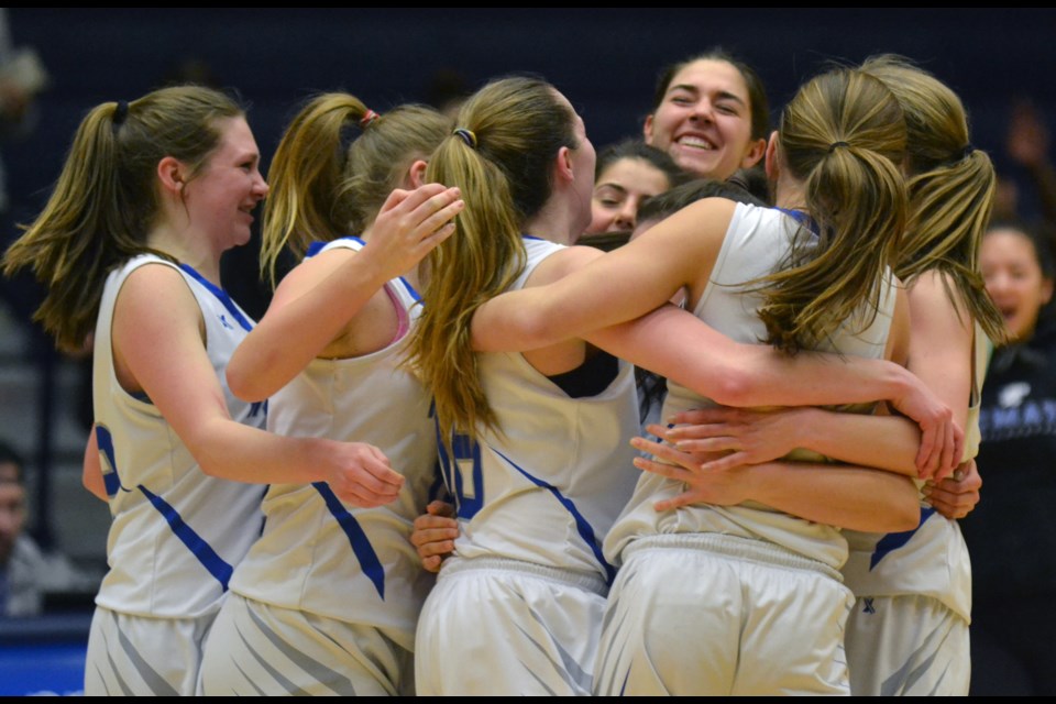 McMath Wildcats celebrate their first-ever trip to the provincial championship game after their 72-52 win over Lord Tweedsmuir on Friday night. The Wildcats will face Brookswood in the title game on Saturday at 5 p.m.