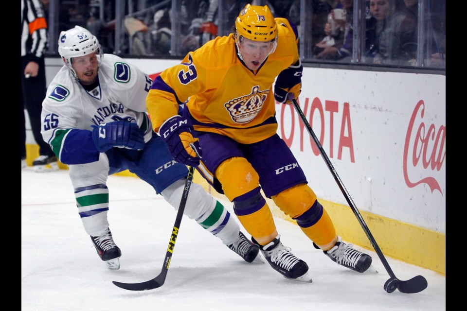 Los Angeles Kings centre Tyler Toffoli (73) wheels past Vancouver Canucks defenceman Alex Biega (55) during the second period of Monday's game in Los Angeles.