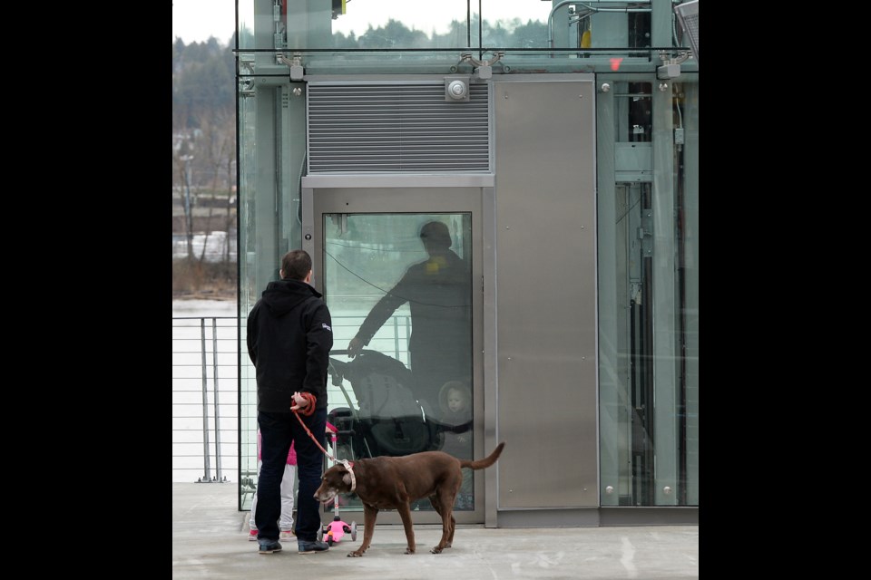 At last: Pedestrians were quick to make use the newly opened elevator leading down to Westminster Pier Park. The elevator opened on March 5 after delays held it up for nearly a year.