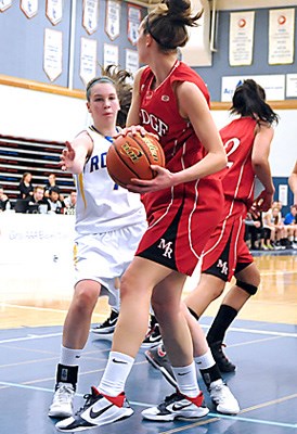 Handsworth (white) versus Maple Ridge (red) on the opening day of the 63rd annual AAA Girls provincial Basketball Championships held at Capilano University's Sportsplex.