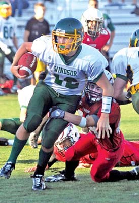 Windor's #12 Ty Marshal (white) carries the ball against Carson Graham in AA football game at Carson Graham field.