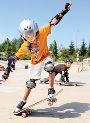 WYATT MAAKER, 8, practises tricks at the skateboard park at Centennial Theatre in North Vancouver. The North Vancouver Recreation Commission is offering summer camps for kids wanting to learn safely while improving their techniques.