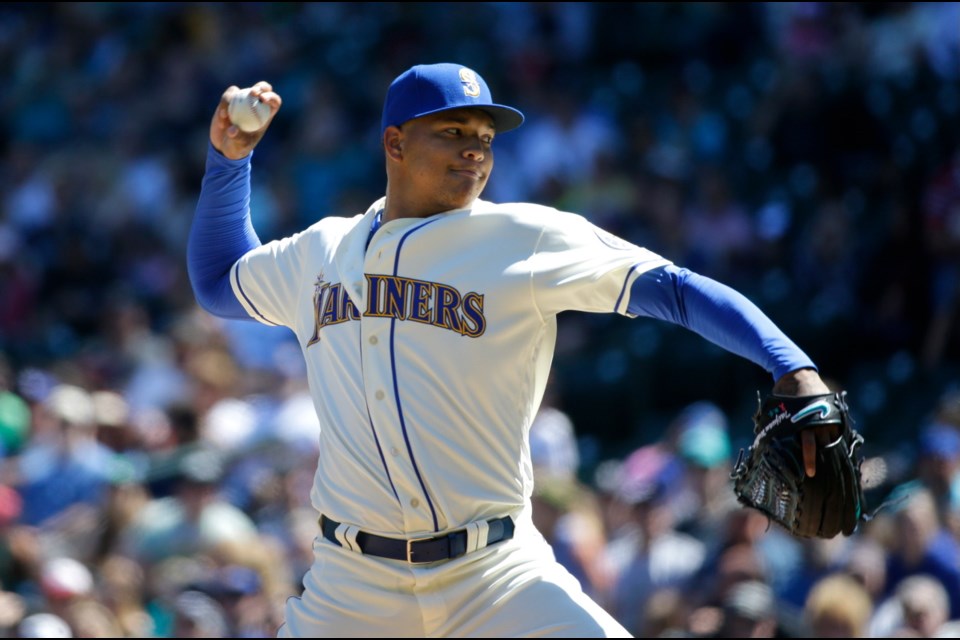 Seattle Mariners starting pitcher Taijuan Walker throws against the Kansas City Royals in the first inning of Sunday's game in Seattle.