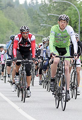 Cyclists head up the Cypress Bowl Road.