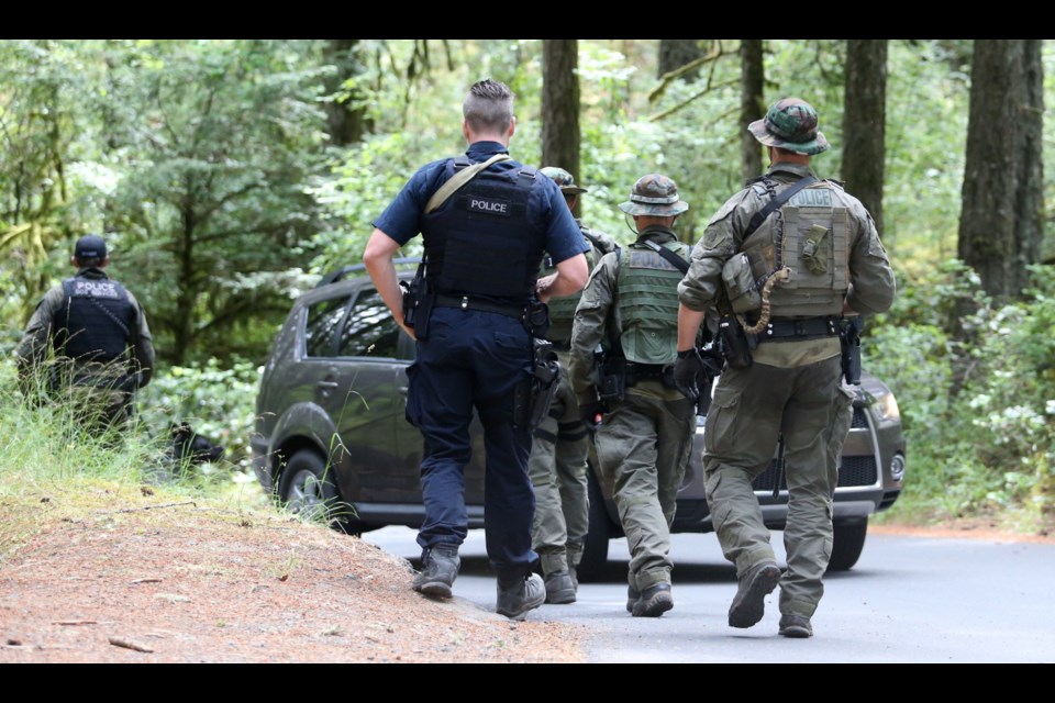 West Shore RCMP were searching for two armed suspects in the Thetis Lake area Friday.