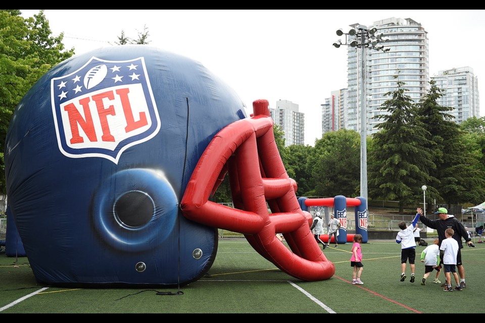 Kids from across 鶹ýӳgot a chance to kick, catch and kibitz with the pros this week at a football camp at Andy Livingston Park Field.