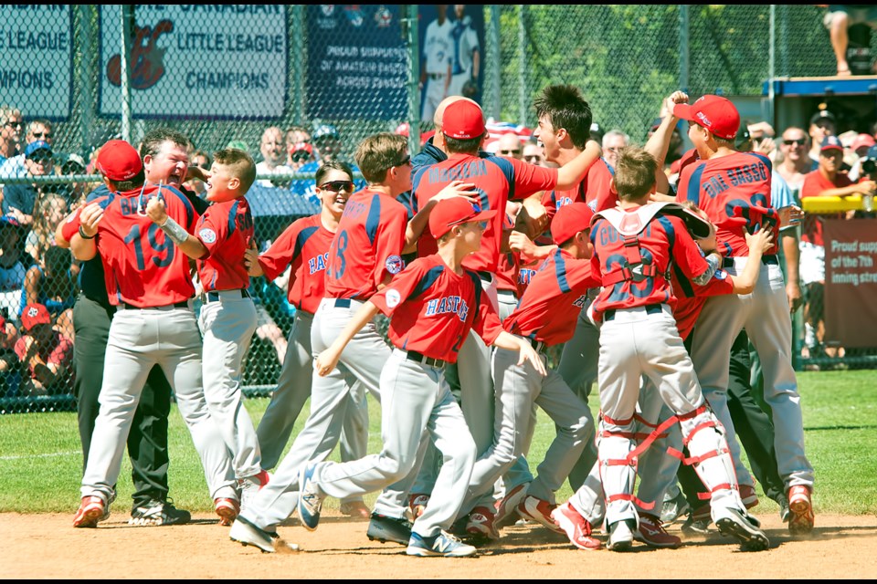 Pandemonium ensues as the Hastings Little League team celebrates after collecting the final out in Saturday's 1-0 win over Whalley.