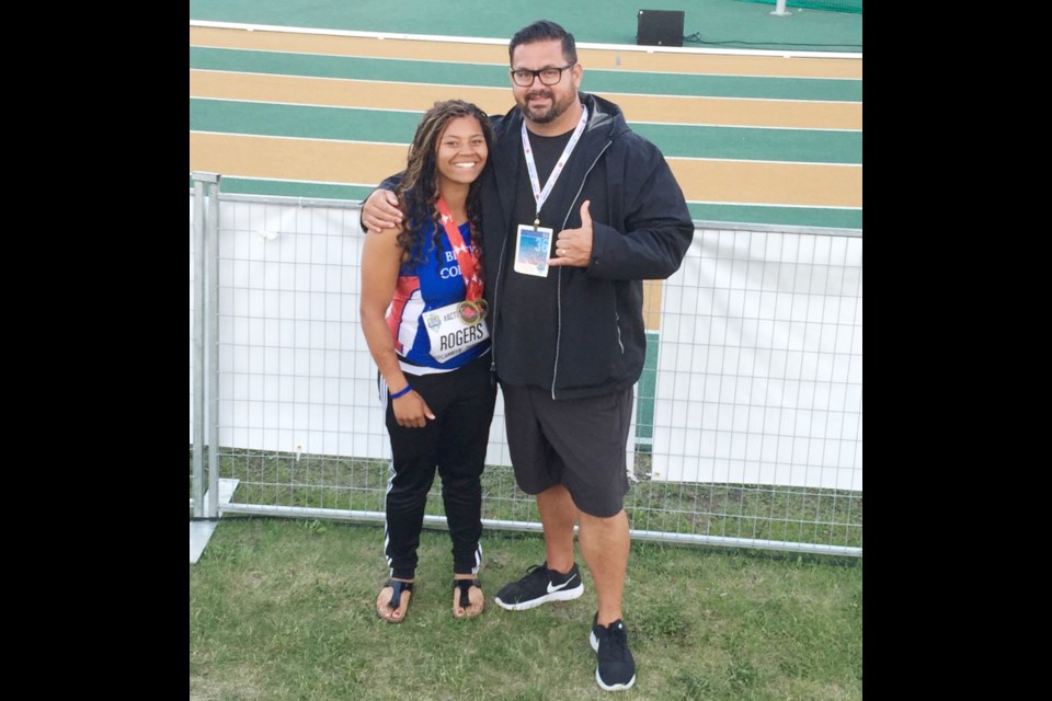 Garret Collier, right, head coach of the Richmond Kajaks, said young athletes, such as Richmond’s Camryn Rogers, will be inspired by the performance both on and off the track of Olympic race walker Evan Dunfee.