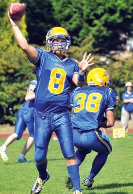 Handsworth Royals quarterback #8 Michael Lemoine throws a pass against Rick Hansen Secondary in first game of season.