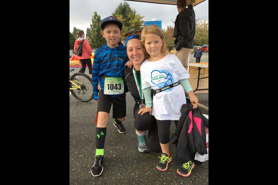 Joyanne Longmore, of View Royal, finished her race and then joined her children, Ben, eight, and Ali, six, for the children's run.