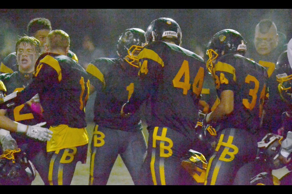 Hugh Boyd Trojans celebrate their 14-7 win over No. 1 ranked Seaquam to improve to 6-0-0 on the season.