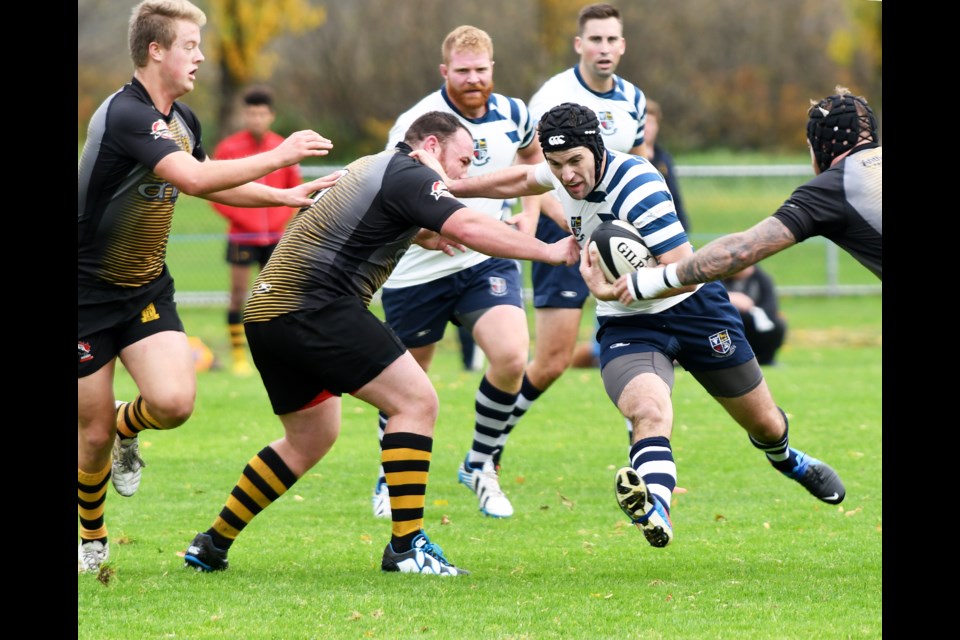 Surrounded by Capilano players, the Burnaby Lake Rugby Club's Gareth Marsden fights for a gain during last Saturday's win at Burnaby Lake.