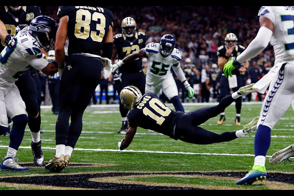 New Orleans Saints wide receiver Brandin Cooks (10) pulls in a touchdown reception in the second half of Sunday's game against the Seattle Seahawks.