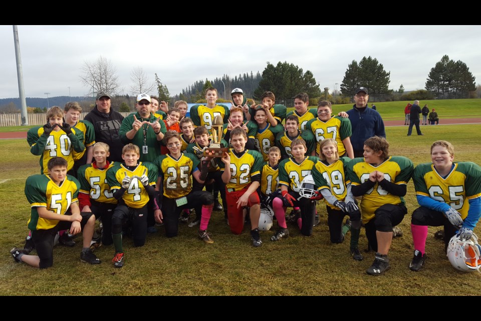 The Prince George junior bantam Axemen celebrate their 42-0 win over the Vanderhoof Vikings in the Prince George Minor Football Association final Saturday at Masich Place Stadium.