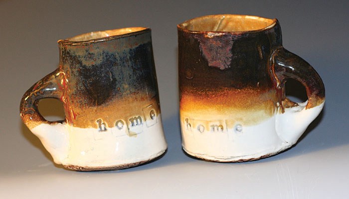 Two mugs crafted by potter Emily Tolmie.