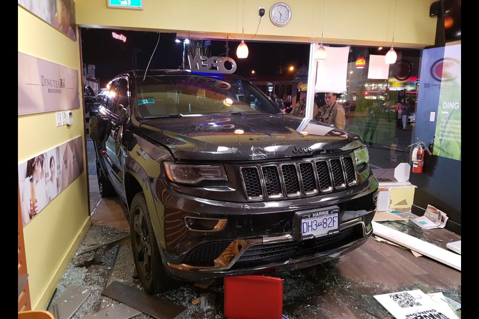 One person suffered minor injuries after an SUV crashed into a business in Saanich on Thursday night.