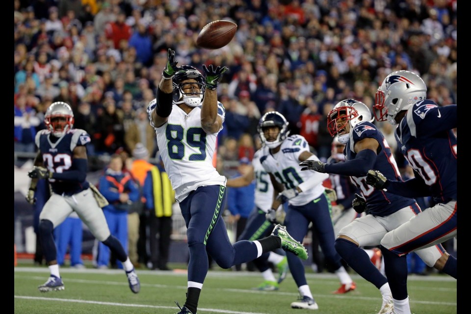 Seattle Seahawks wide receiver Doug Baldwin (89) catches a pass for his third touchdown of the game during the second half of Sunday's game against the New England Patriots in Foxborough, Mass. The Seahawks won 31-24.