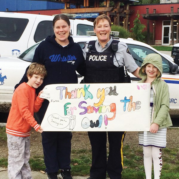 Megan Kelso and RCMP Const. Whitby with Cody and Kalea.