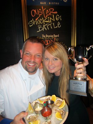 B.C. Lion Angus Reid presented the winner's trophy to The Rush's Fiona Forbes, Tableau Bar + Bistro's first celeb oyster shucking champion.