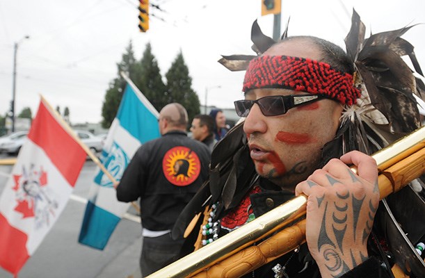 Roughly 30 Musqueam people and supporters staged a demonstration Tuesday outside the Mountain View Cemetery at 41st and Fraser. Protestors included former Canuck tough guy Gino Odjick.